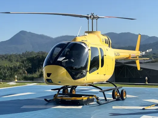 Yellow skid helicopter on the AEROTANK on the helipad