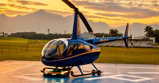AEROTANK under a Robinson R44 on the helipad at sunset