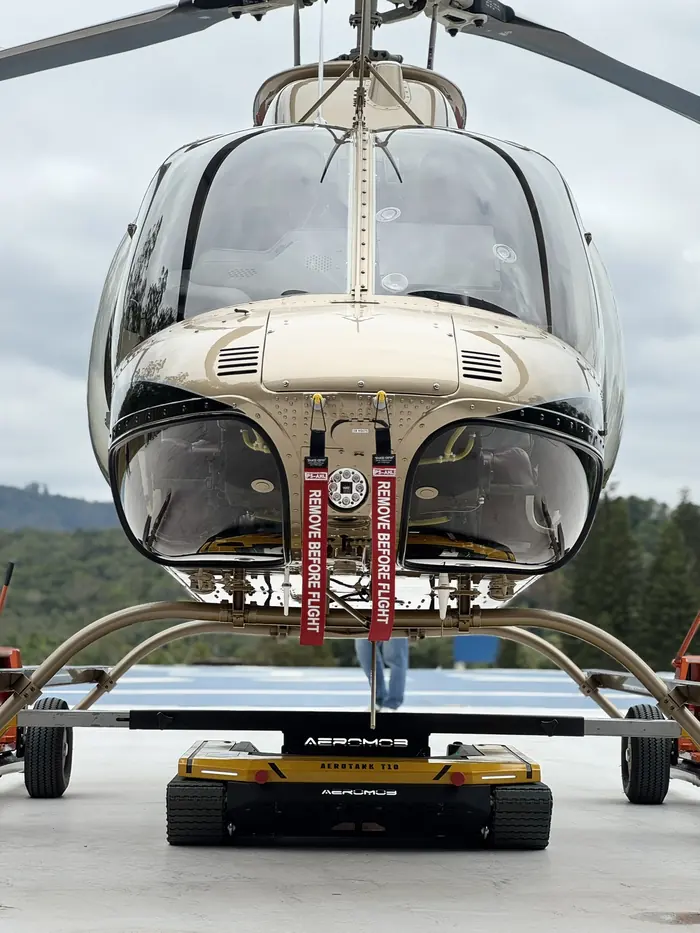 Bell helicopter seen from the front on the AEROTANK tug on the helipad