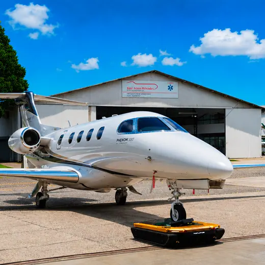 AEROTANK towing an Embraer Phenom business jet out of the hangar